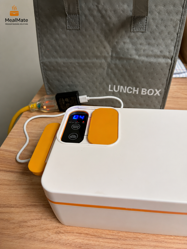 MealMate™ XL heated lunch box with black exterior and stainless steel interior, designed for keeping meals warm on the go.